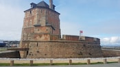 A stone and terracotta tower