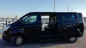 The side of a late model van with its doors open