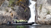 Guests viewing a waterfall from a rigid inflatable boat