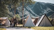 Guests mingling with Vikings in a medieval village setting