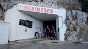 The entrance to a cave with a sign that reads World War 2 Tunnels