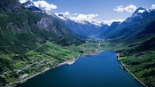 An aerial view of mountains, fjords and a lake amid the Jostedal Glacier