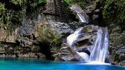 A waterfall in a tropical setting