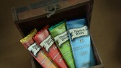 A small wooden chest filled with 4 Pirates Booty chocolate bars