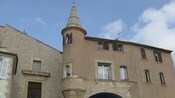 A historic building with a stone tower 
