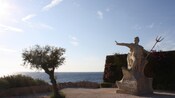 A statue of the Roman god Neptune on the water's edge