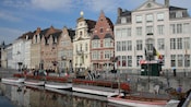 A series of gabled buildings lining a waterfront