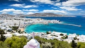 The isle of Mykonos reveals swatches of sandy beach and minimalist, flat roof architecture