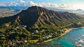 A beach runs along one side of a mountain range