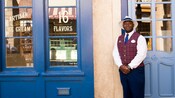 A VIP guide stands proudly outside an ice cream parlor