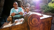 WDW A family rides the Seven Dwarfs Mine Train attraction