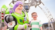 A young boy is all smiles meeting Buzz Lightyear at Tomorrowland A young boy is all smiles meeting Buzz Lightyear at Tomorrowland