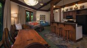L’intérieur d’une villa avec un mélange de meubles en bois et de meubles rembourrés, et une cuisine