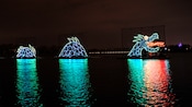 A sea monster made of lights on a lake