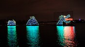 A sea monster made of lights on a lake