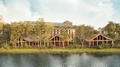 Pinos rodeando 3 cabañas frente al lago en Cooper Creek Villas & Cabins en Disney’s Wilderness Lodge