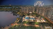 An artist rendering of Disney’s Riviera Resort illuminated at night with fireworks blasting off in the sky An artist rendering of Disney’s Riviera Resort illuminated at night with fireworks blasting off in the sky