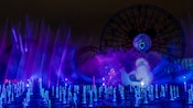 Jets of water shoot into the air as an animation of Shelley Marie and Ursula are projected onto a grand fountain during the Villainous nighttime spectacular