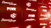 A lit sign lists lounges on the ship, including 687, District Lounge, Pink, Skyline Lounge and Evolution