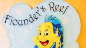 A sign with a smiling sea horse says Flounders Reef