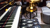 The keyboard of a grand piano and a bench