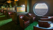 A lounge has wall partitions for privacy between rows of comfortable chairs