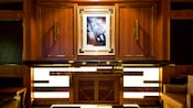 An art print hangs between 2 wooden panels in the Skyline Lounge
