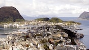 Aerial shot of buildings with pointed roofs covering a peninsula