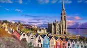 A row of houses poised in front of the Church of the Holy Rosary cathedral