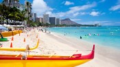 Outrigger canoes parked on the sand in Waikiki