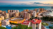 Malagas high rise buildings surround a sports amphitheater along its Mediterranean coast