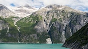 A mountain range near a lake