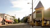 Wood panelled bulidings line an empty street