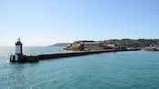 A lighthouse at the end of a pier