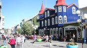 A pedestrian street featuring a charming Victorian style sidewalk café