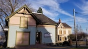 A house with a sign that reads Flavel House Visitor Center