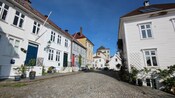 Well preserved row cottages lining a cobblestone street