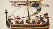 A tapestry of sailors in a boat