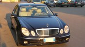A Mercedes Benz sedan from its front