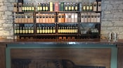 A store display of whiskey in rows of bottles and boxes