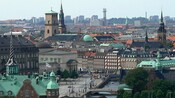 The Copenhagen cityscape reveals spires and brick gabled buildings