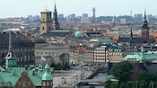 The Copenhagen cityscape reveals spires and brick gabled buildings