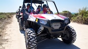 4 Guests sit in the front car of vehicle caravan