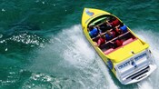 A group of people on a speed boat with a sign that reads Crazy Horse Jet Boat Tours