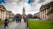 Visitors stroll the campus of Trinity College