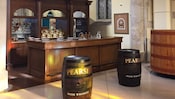 A bar inside Pearse Lyons Distillery with 2 barrels