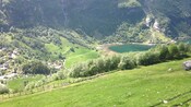A lush valley with a lake