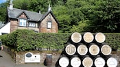 A pyramid of whisky casks outside Glengoyne Distillery