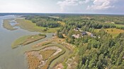 An archipelago with small, rustic residential areas and swaths of forest