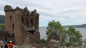 Tourists exploring the ruins of Urquhart Castle